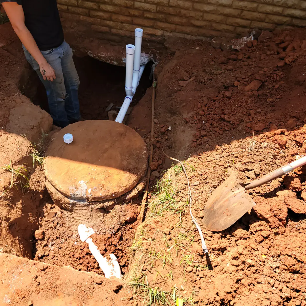 Septic tank uncovered and connected during excavation work in East Texas